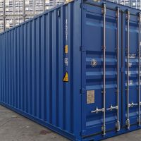 A sturdy 40ft blue shipping container positioned in a storage yard, surrounded by stacked containers in the background.